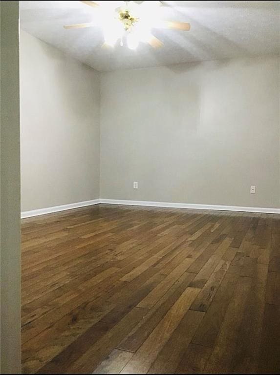 3535 Cameron Cir, Gainesville, GA 30506 - spare room featuring dark wood-style floors, baseboards, and a ceiling fan