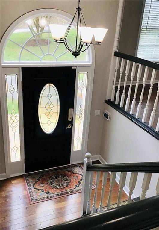 3535 Cameron Cir, Gainesville, GA 30506 - foyer entrance featuring hardwood / wood-style flooring, a chandelier, baseboards, and stairway