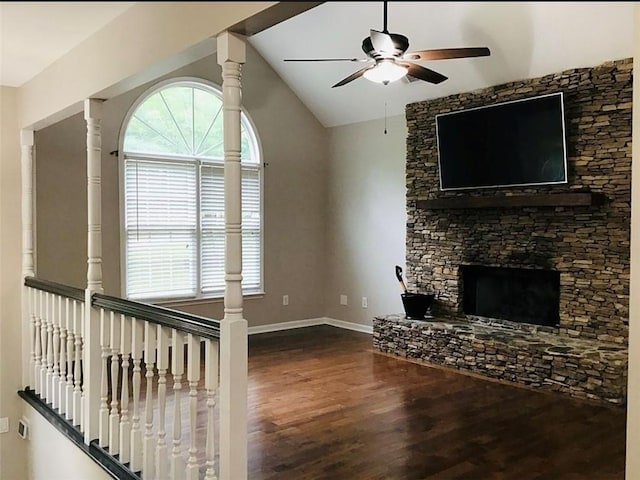 3535 Cameron Cir, Gainesville, GA 30506 - unfurnished living room featuring ceiling fan, wood finished floors, a stone fireplace, lofted ceiling, and baseboards