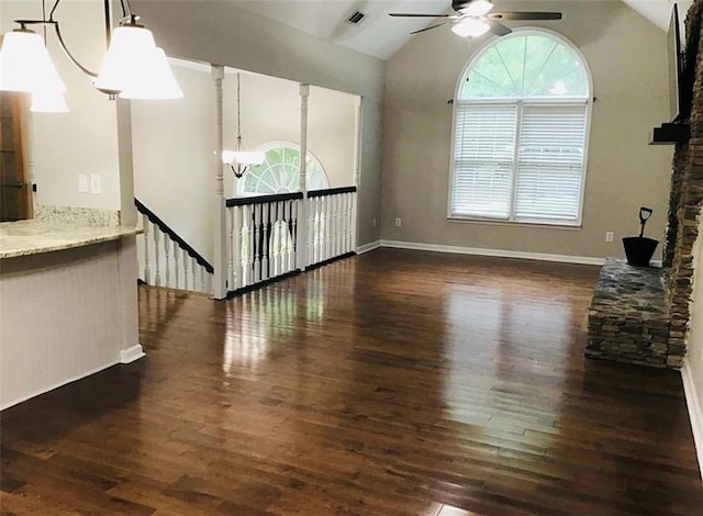 3535 Cameron Cir, Gainesville, GA 30506 - unfurnished living room featuring a ceiling fan, dark wood-style flooring, plenty of natural light, lofted ceiling, and baseboards