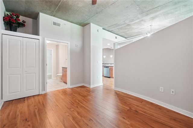 spare room featuring light hardwood / wood-style floors