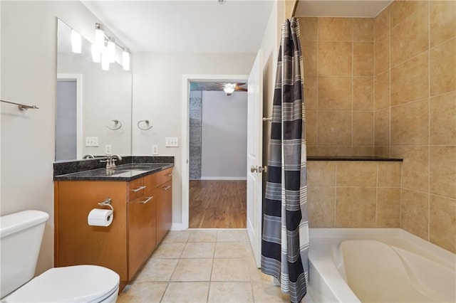 full bathroom with tile patterned flooring, vanity, shower / tub combo, and toilet