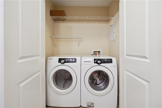 washroom featuring washer and clothes dryer