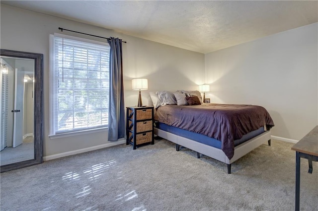 6700 Roswell Rd Unit 32C, Atlanta, GA 30328 - bedroom with carpet flooring, baseboards, and a textured ceiling