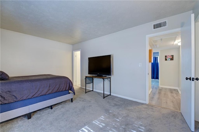 6700 Roswell Rd Unit 32C, Atlanta, GA 30328 - bedroom with carpet flooring, baseboards, and a textured ceiling