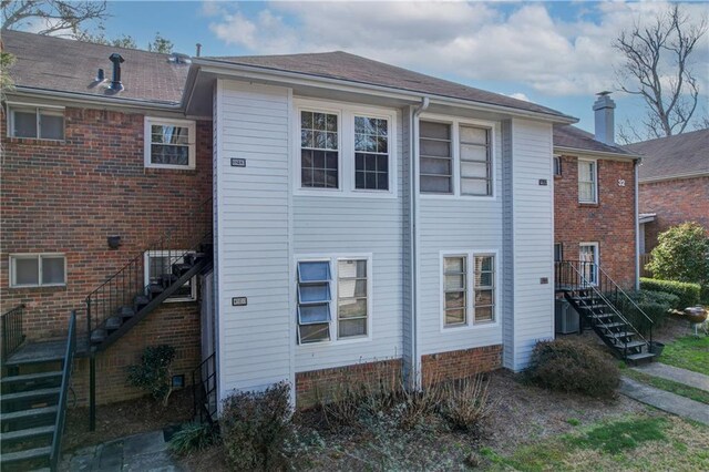 6700 Roswell Rd Unit 32C, Atlanta, GA 30328 - view of side of property with stairs and brick siding