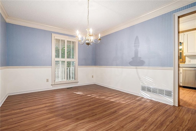 1488 White Columns Blvd, Canton, GA 30115 - spare room with ornamental molding, a chandelier, wallpapered walls, wainscoting, and wood finished floors