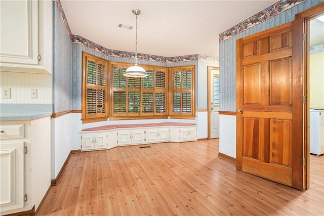1488 White Columns Blvd, Canton, GA 30115 - unfurnished dining area with wallpapered walls and light wood-style flooring