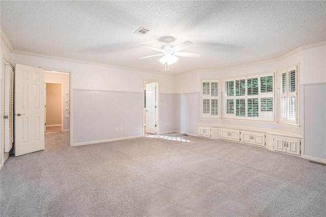 1488 White Columns Blvd, Canton, GA 30115 - carpeted spare room with crown molding, a ceiling fan, and a textured ceiling