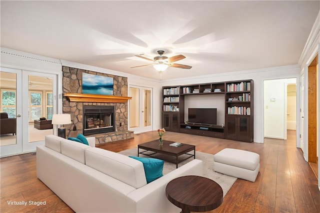 1488 White Columns Blvd, Canton, GA 30115 - living area with hardwood / wood-style floors, a ceiling fan, a fireplace, ornamental molding, and french doors