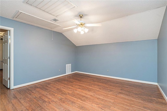 1488 White Columns Blvd, Canton, GA 30115 - bonus room featuring attic access, a ceiling fan, vaulted ceiling, wood finished floors, and a textured ceiling