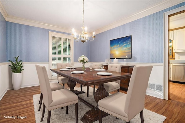 1488 White Columns Blvd, Canton, GA 30115 - dining area featuring wallpapered walls, crown molding, a wainscoted wall, a chandelier, and wood finished floors