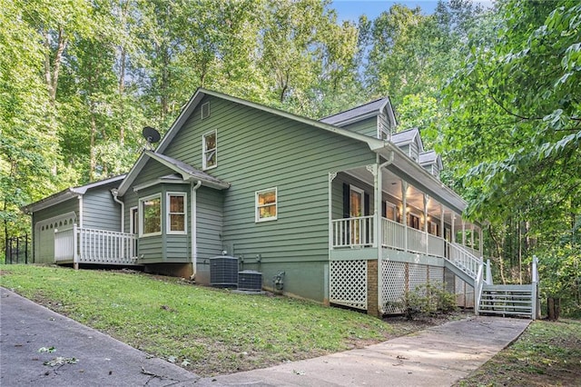 1488 White Columns Blvd, Canton, GA 30115 - view of side of property with a porch, a lawn, crawl space, stairway, and a garage