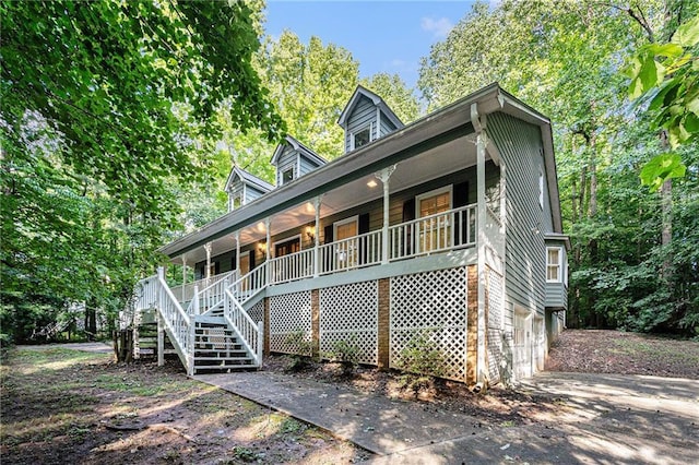 1488 White Columns Blvd, Canton, GA 30115 - view of front facade featuring a porch, stairway, and driveway