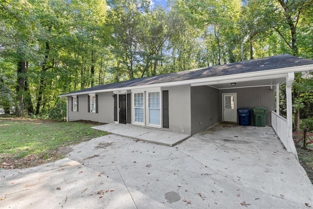 rear view of house featuring a carport