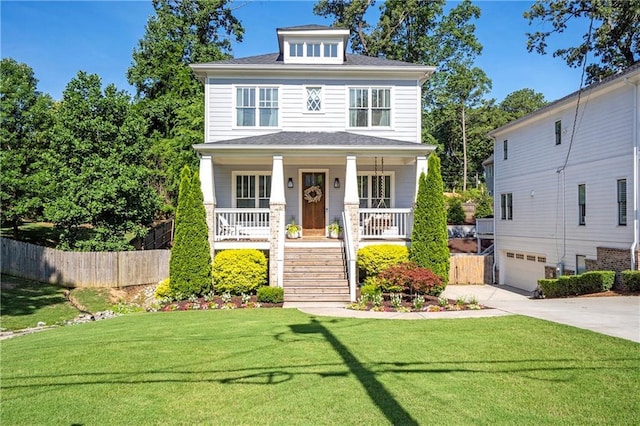 traditional style home with an attached garage, a front lawn, a porch, stairway, and concrete driveway
