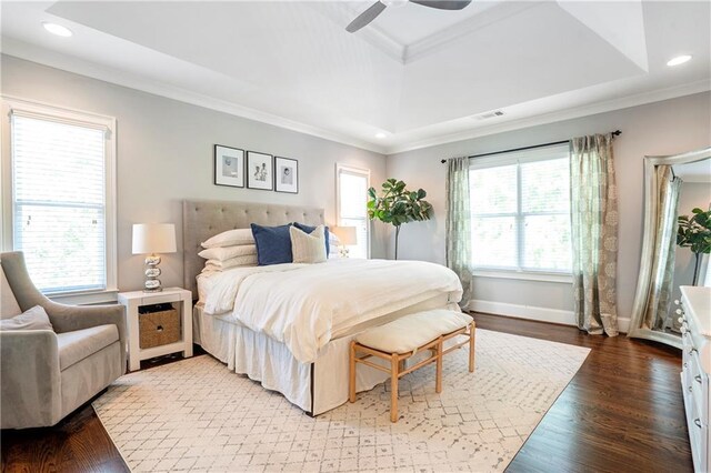 bedroom with visible vents, recessed lighting, crown molding, and a tray ceiling
