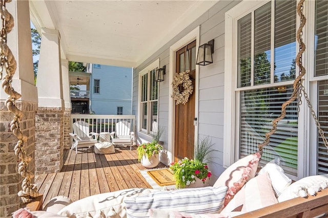 balcony featuring a porch