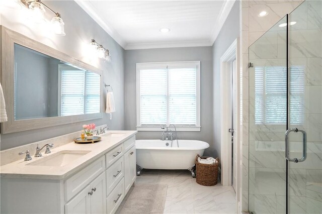 full bath with crown molding, a freestanding bath, a sink, marble finish floor, and a shower stall
