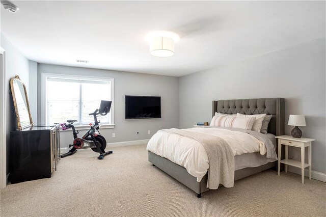 bedroom with baseboards, carpet, and visible vents