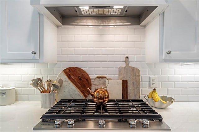 3042 Jefferson St, Atlanta, GA 30341 - kitchen featuring stainless steel gas stovetop, backsplash, custom range hood, and light countertops