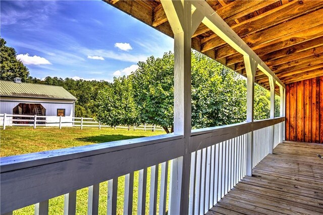 wooden terrace with a yard