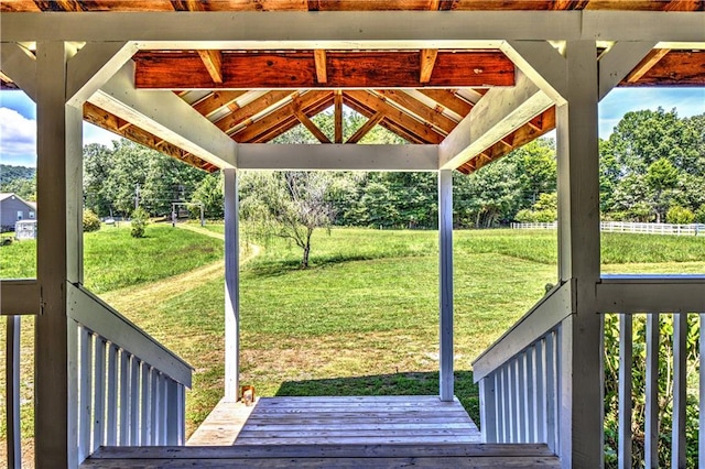 wooden deck with a gazebo and a yard