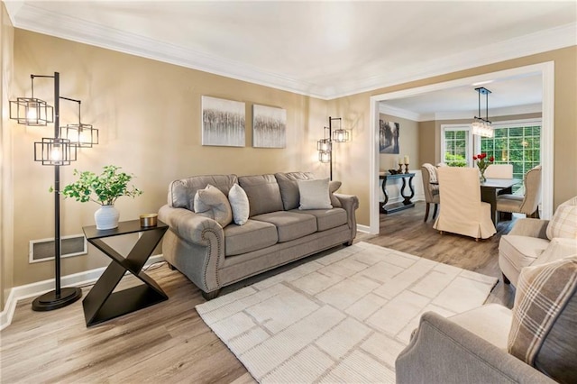 910 Kings Arms Way, Johns Creek, GA 30022 - living room featuring wood finished floors and ornamental molding