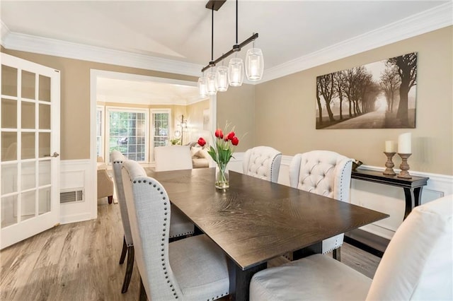 910 Kings Arms Way, Johns Creek, GA 30022 - dining room featuring light wood-style floors, crown molding, and a wainscoted wall