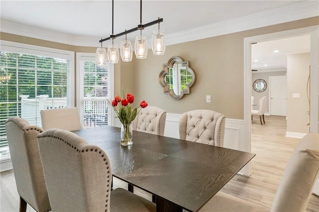 910 Kings Arms Way, Johns Creek, GA 30022 - dining space featuring wainscoting, light wood-style floors, ornamental molding, and a decorative wall