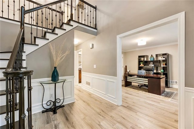 910 Kings Arms Way, Johns Creek, GA 30022 - stairway with wood finished floors, wainscoting, ornamental molding, and a decorative wall