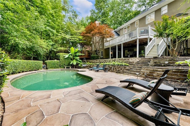 910 Kings Arms Way, Johns Creek, GA 30022 - view of swimming pool with stairway, a patio, and a wooden deck