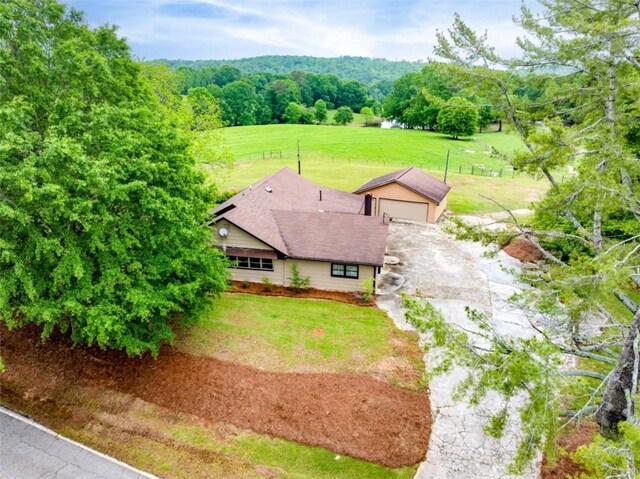 birds eye view of property featuring a rural view