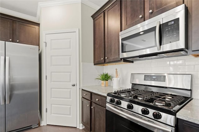 kitchen featuring appliances with stainless steel finishes, crown molding, dark brown cabinets, and light stone countertops