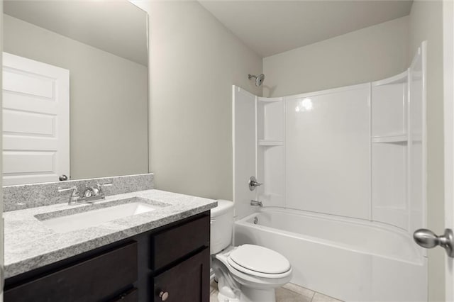 bathroom featuring washtub / shower combination, vanity, toilet, and tile patterned floors