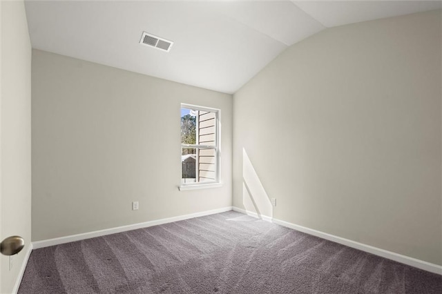 unfurnished room featuring vaulted ceiling, carpet, visible vents, and baseboards