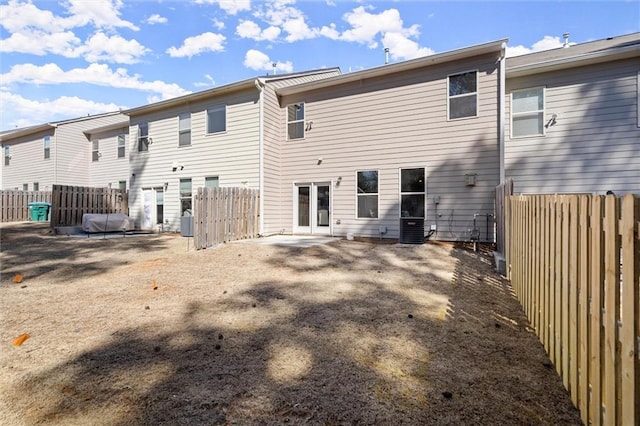 back of property featuring a fenced backyard