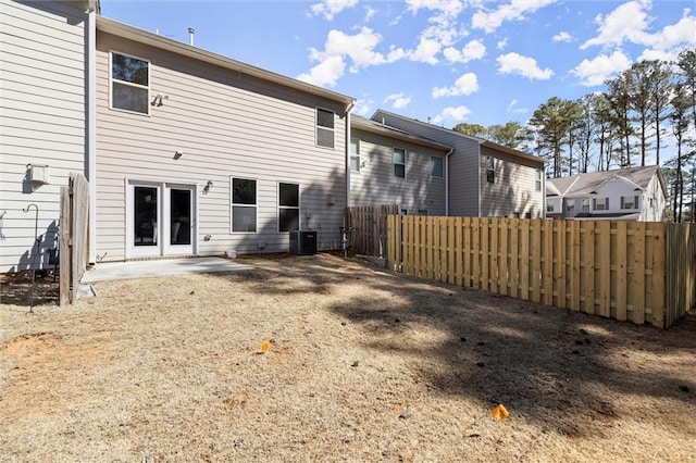 back of house with a patio area, fence, and central AC unit