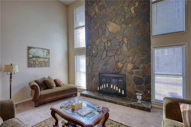 744 Hampton Locust Grove Rd, Hampton, GA 30228 - carpeted living room featuring a towering ceiling and a stone fireplace