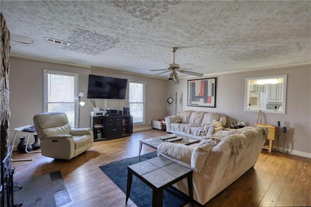 744 Hampton Locust Grove Rd, Hampton, GA 30228 - living room with a textured ceiling, ornamental molding, hardwood / wood-style flooring, and ceiling fan