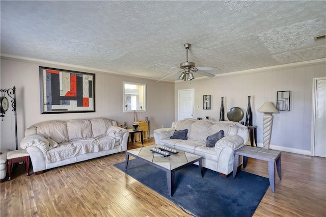 744 Hampton Locust Grove Rd, Hampton, GA 30228 - living room featuring ceiling fan, wood-type flooring, and a textured ceiling