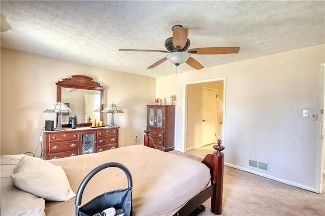 744 Hampton Locust Grove Rd, Hampton, GA 30228 - bedroom featuring ceiling fan, a textured ceiling, and light colored carpet