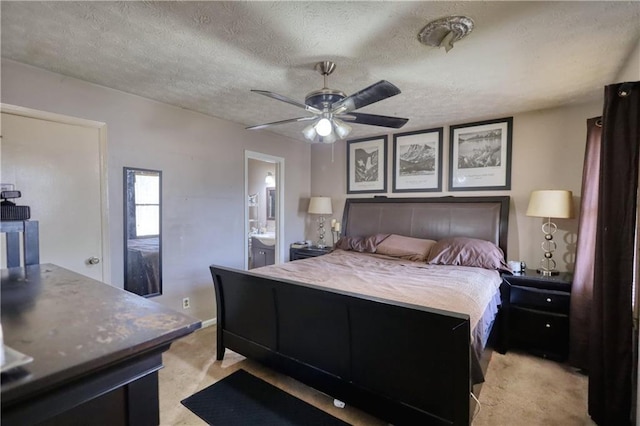 744 Hampton Locust Grove Rd, Hampton, GA 30228 - bedroom with a textured ceiling, light carpet, connected bathroom, and ceiling fan