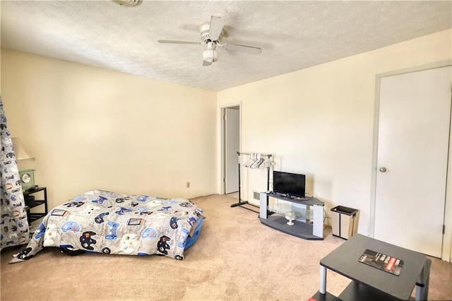 744 Hampton Locust Grove Rd, Hampton, GA 30228 - bedroom with ceiling fan, a textured ceiling, and light colored carpet
