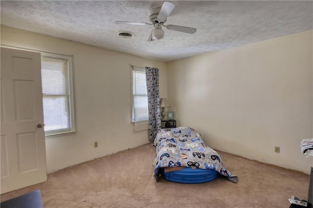 744 Hampton Locust Grove Rd, Hampton, GA 30228 - carpeted bedroom featuring ceiling fan and a textured ceiling