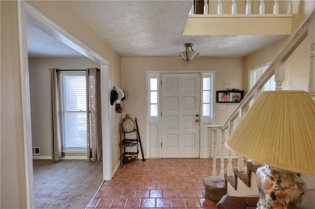 744 Hampton Locust Grove Rd, Hampton, GA 30228 - foyer featuring a textured ceiling and carpet