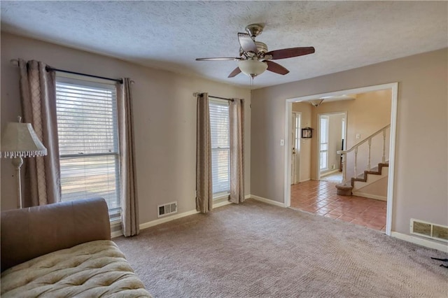 744 Hampton Locust Grove Rd, Hampton, GA 30228 - unfurnished room featuring a textured ceiling, light carpet, and a wealth of natural light