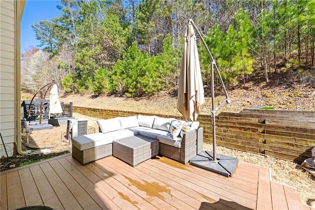 wooden terrace featuring outdoor lounge area