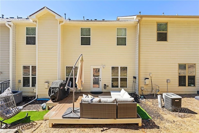 back of property featuring an outdoor hangout area and central AC