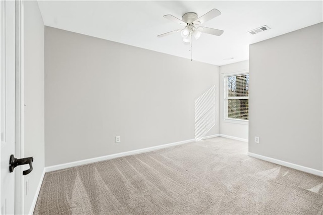 unfurnished room with light carpet and ceiling fan